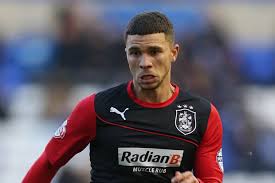 Huddersfield top scorer Nakhi Wells set the Terriers up for victory by grabbing the opening goal at the John Smiths Stadium