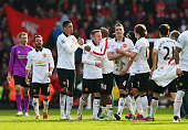Manchester United's players celebrate their 2-1 win over Liverpool at Anfield.