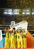 Australia's players hold the trophy aloft as they celebrate their fiffth world cup success.